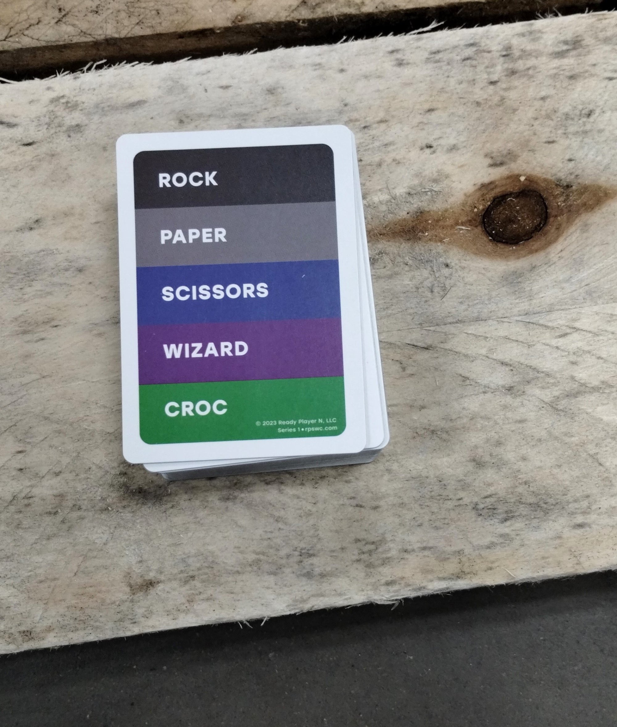 The game's cut cards, featuring card backs, shown at end of production line.